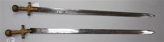 A near pair of Indian sword tulwars, late 19th century, L 81cm (blade)